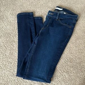 dark blue levi’s, fit is skinny